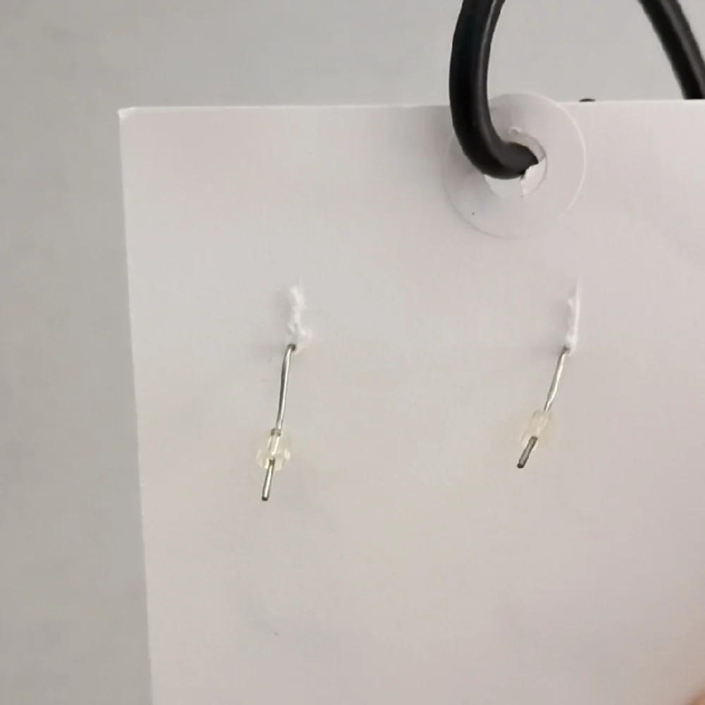 Elegant‎ Silver Colored Twisted Hoop Earrings - Picture 2 of 3